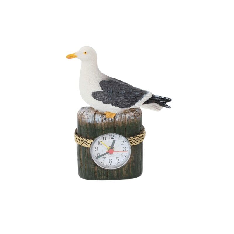 Meeuw op strandpaal klok met wekker